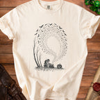 Goblin with bag of keys, pumpkin, and swarm of bats graphic on cream t-shirt.