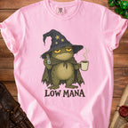 Pink t-shirt with a frog wizard holding a potion and coffee, text reads "LOW MANA".