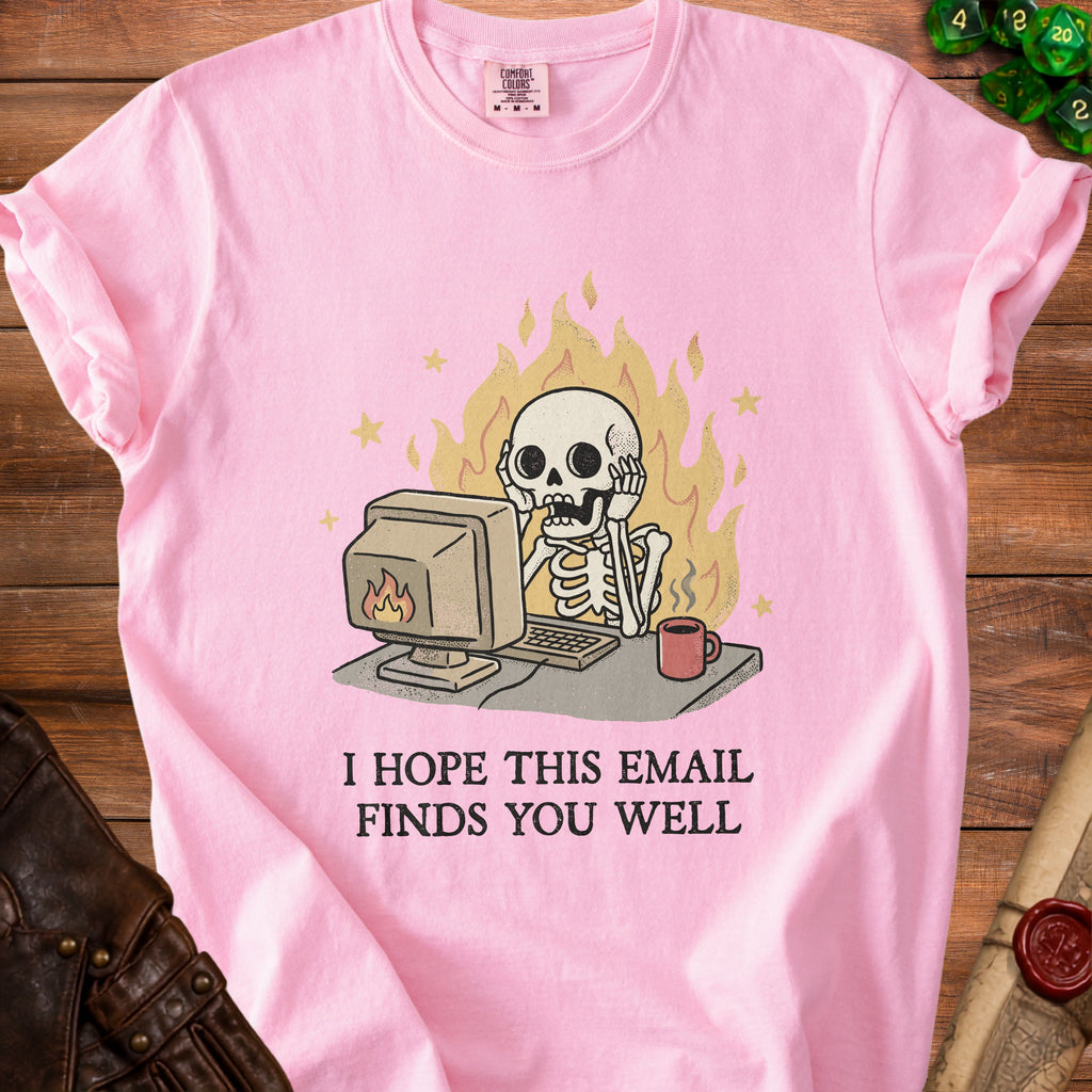Pink t-shirt with skeleton at computer, flames, and text "I hope this email finds you well."