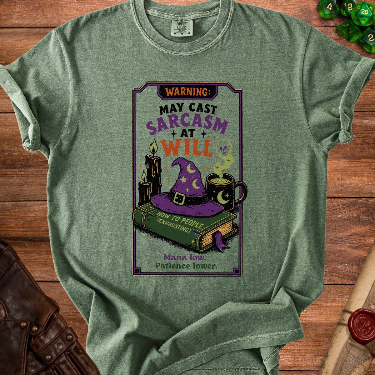 Green t-shirt with "Warning: May Cast Sarcasm At Will" and wizard imagery.