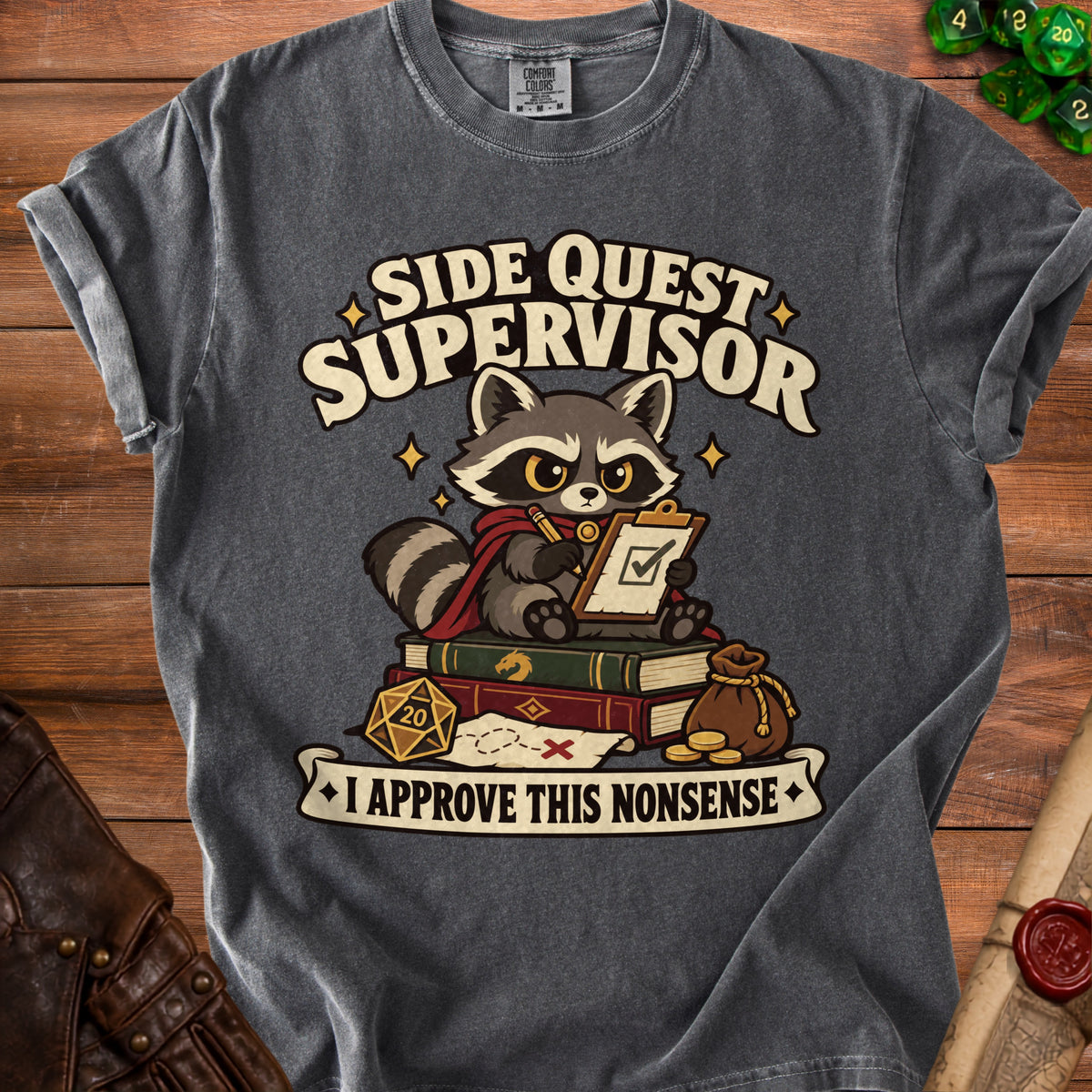 Charcoal t-shirt featuring a graphic of a raccoon holding a clipboard with text reading "Side Quest Supervisor" and "I Approve This Nonsense."