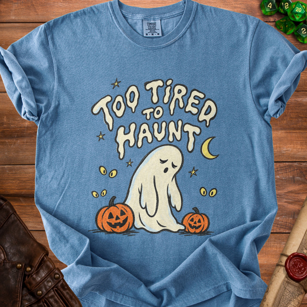 Blue t-shirt with ghost and pumpkins graphic saying "Too tired to haunt".