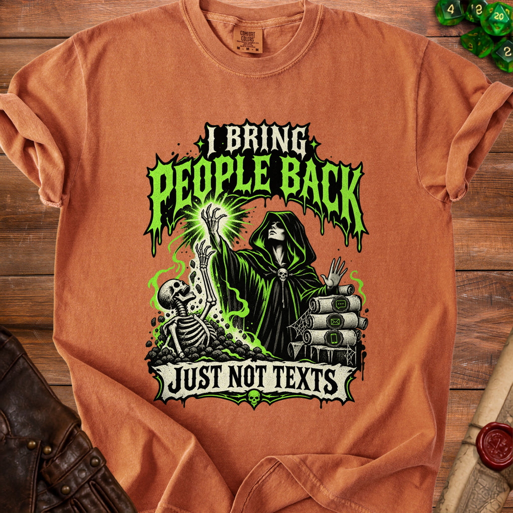 Orange t-shirt with a graphic of a hooded figure, skeleton, and text "I BRING PEOPLE BACK JUST NOT TEXTS".