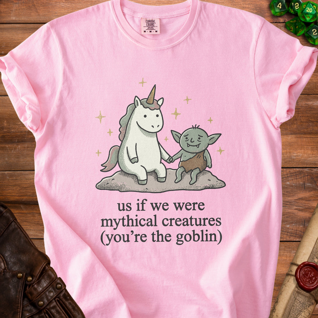 Pink t-shirt with unicorn and goblin holding hands with text "us if we were mythical creatures (you're the goblin)".