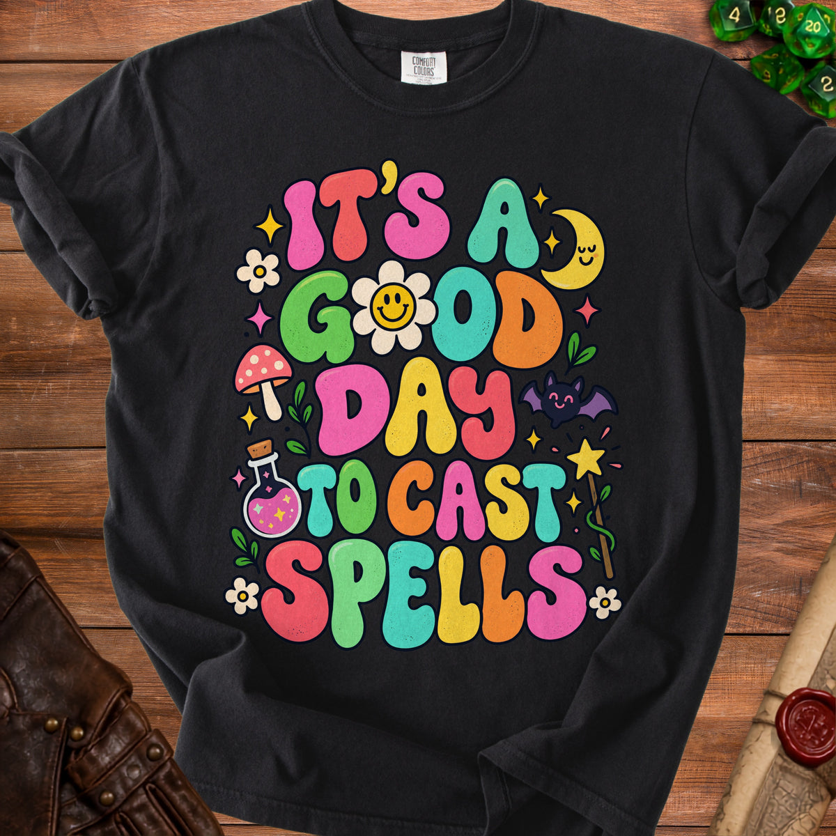 Black t-shirt with colorful "It's a good day to cast spells" graphic.