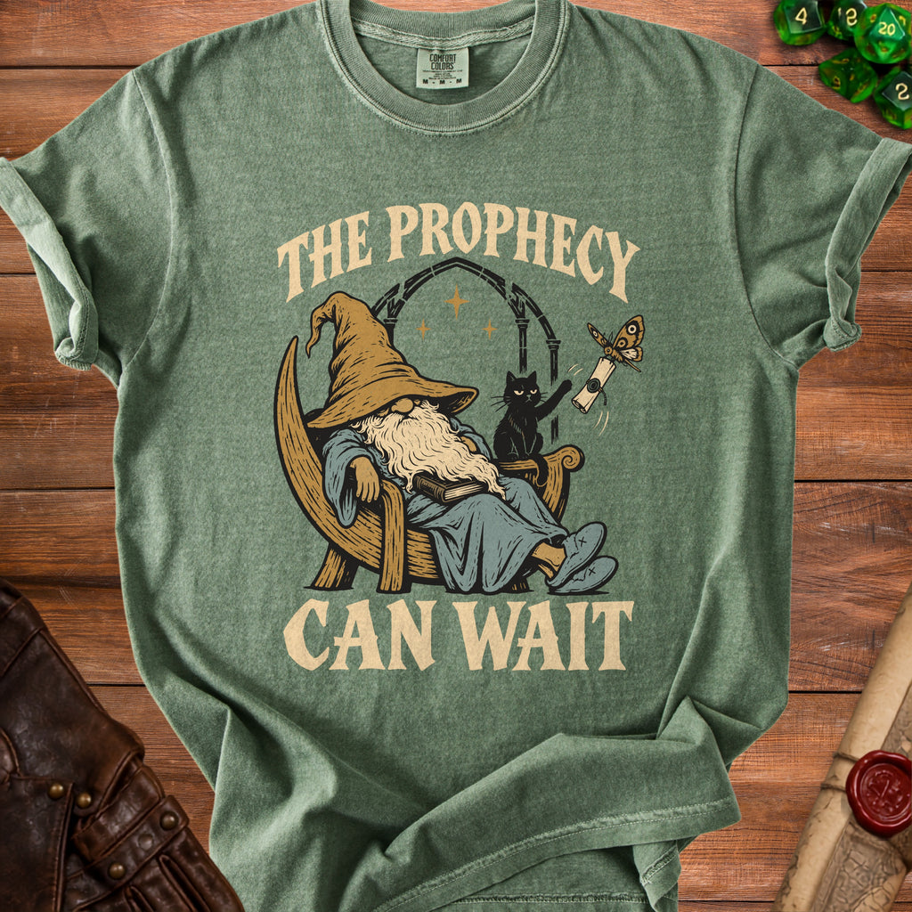 Green t-shirt with wizard, cat, and moth graphic and text "The Prophecy Can Wait".