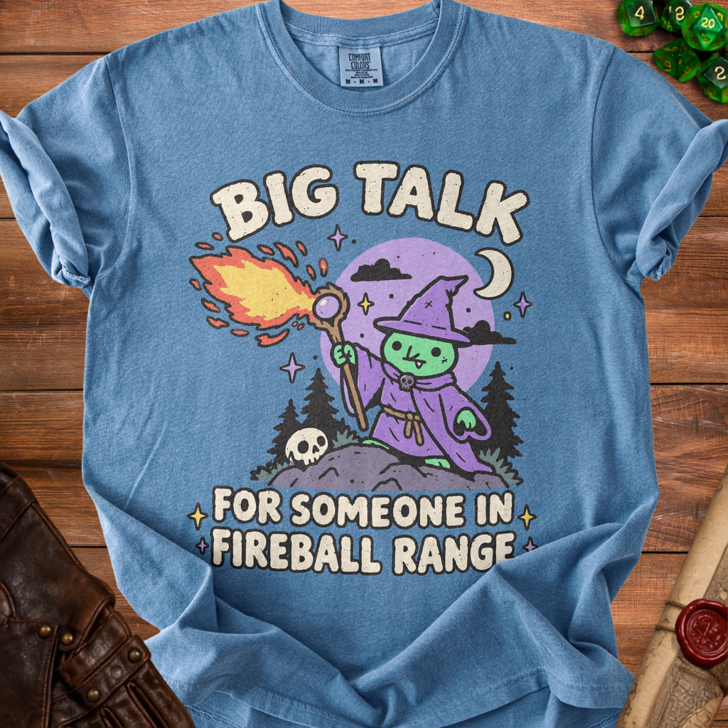 Blue t-shirt with "BIG TALK FOR SOMEONE IN FIREBALL RANGE" text and wizard graphic.