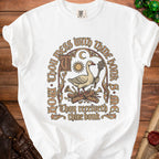 White t-shirt with goose holding mace, sun, moon, and text.