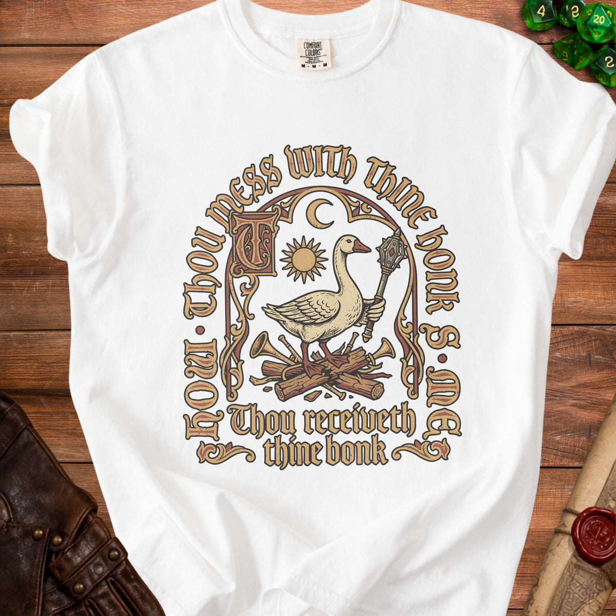 White t-shirt with goose holding mace, sun, moon, and text.