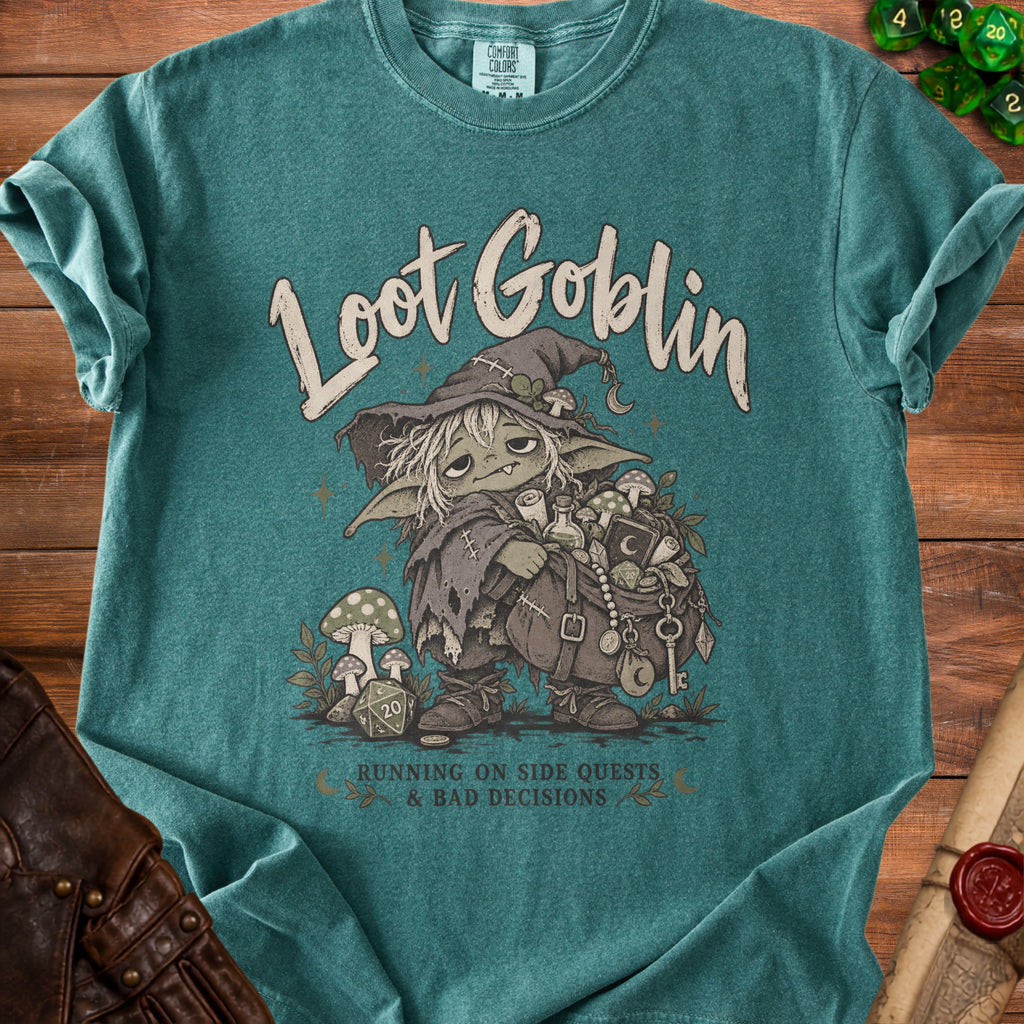 Teal t-shirt with "Loot Goblin" graphic of a goblin with treasure and "Running on side quests & bad decisions".