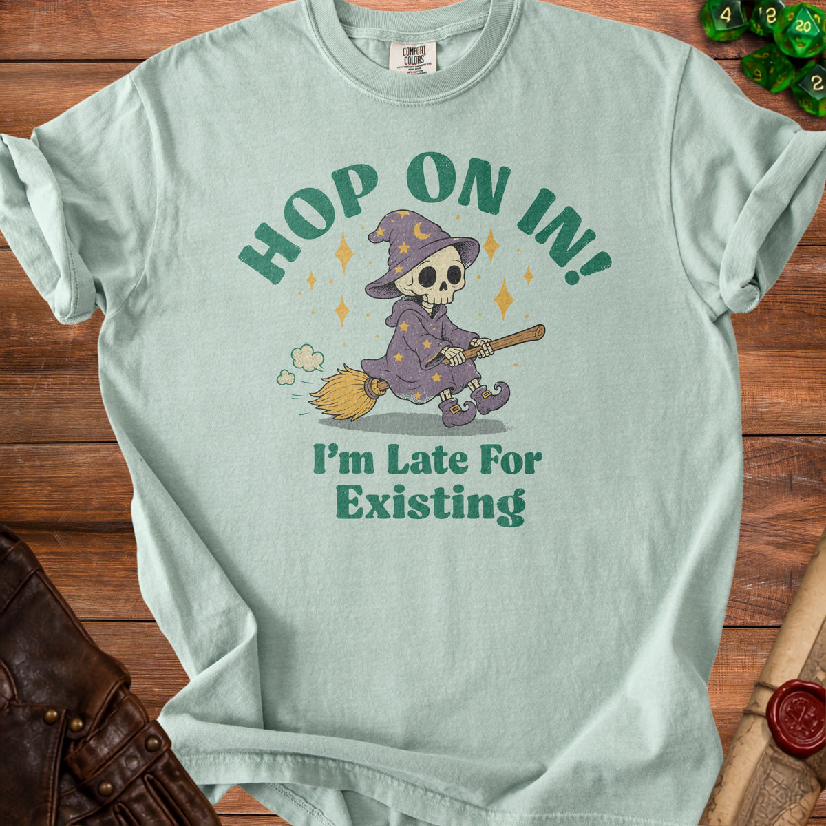 Light blue t-shirt with skeleton wizard graphic and text "Hop On In! I'm Late For Existing."