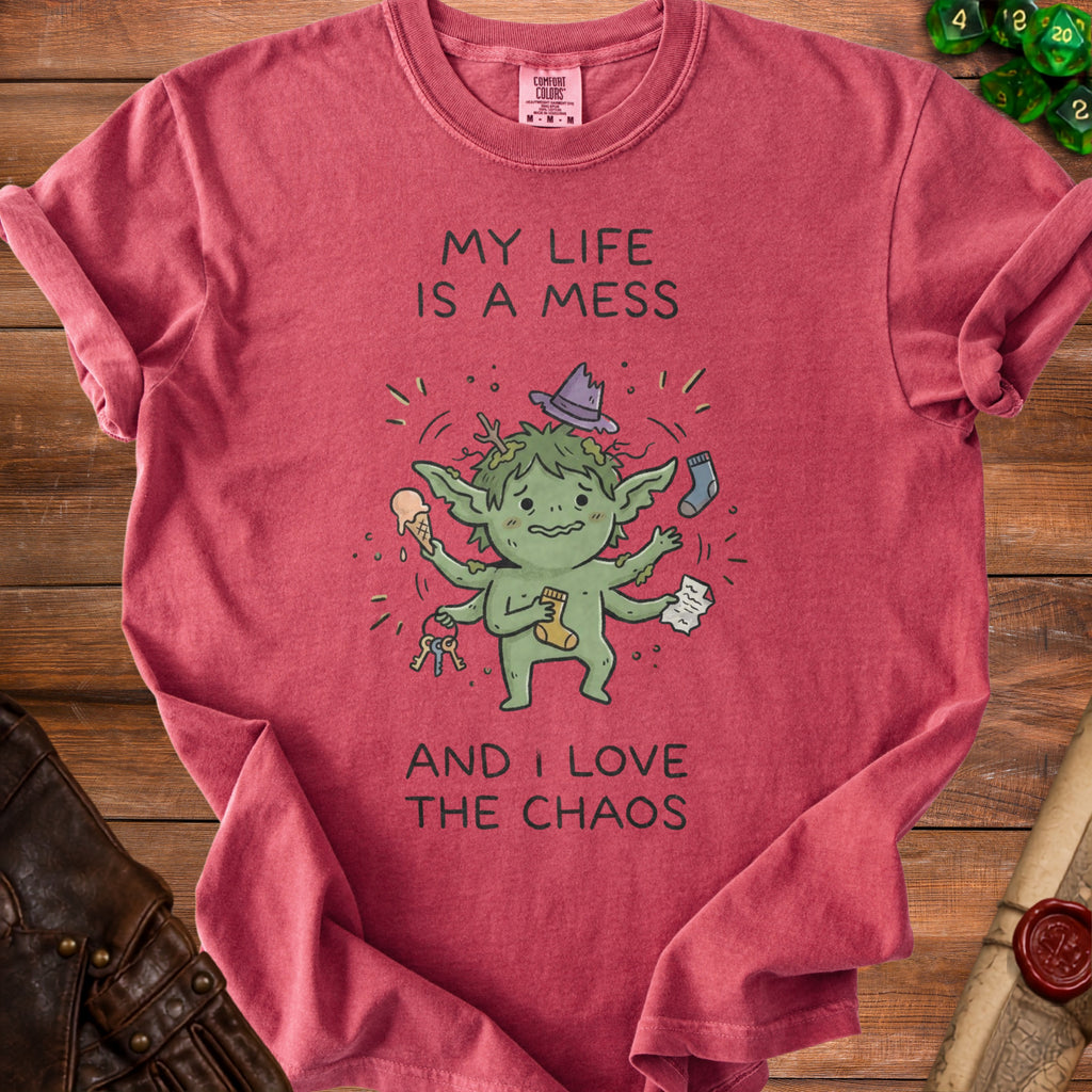 Red t-shirt with a cartoon goblin graphic and text "MY LIFE IS A MESS AND I LOVE THE CHAOS".