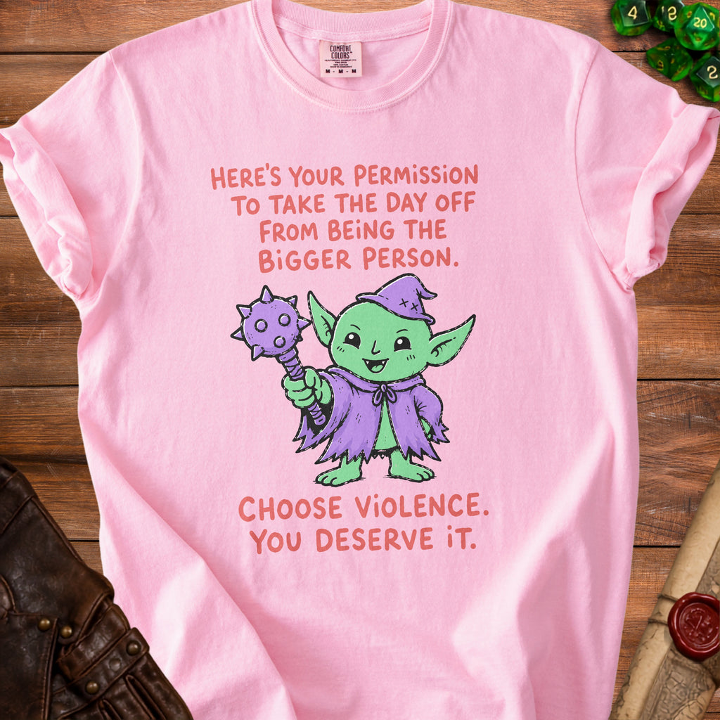 Pink t-shirt with a green goblin graphic and text saying "Here's your permission to take the day off from being the bigger person. Choose violence. You deserve it."