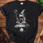 Black t-shirt with wizard frog on mushroom graphic and text "I FOLLOWED THE VIBES."
