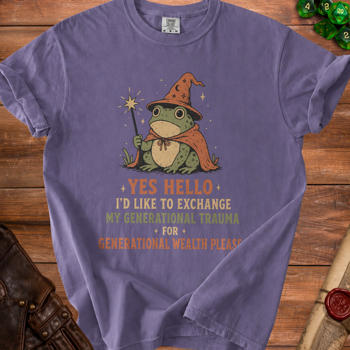 Purple t-shirt with wizard frog graphic and text: "Yes Hello, I'd like to exchange my generational trauma for generational wealth please."