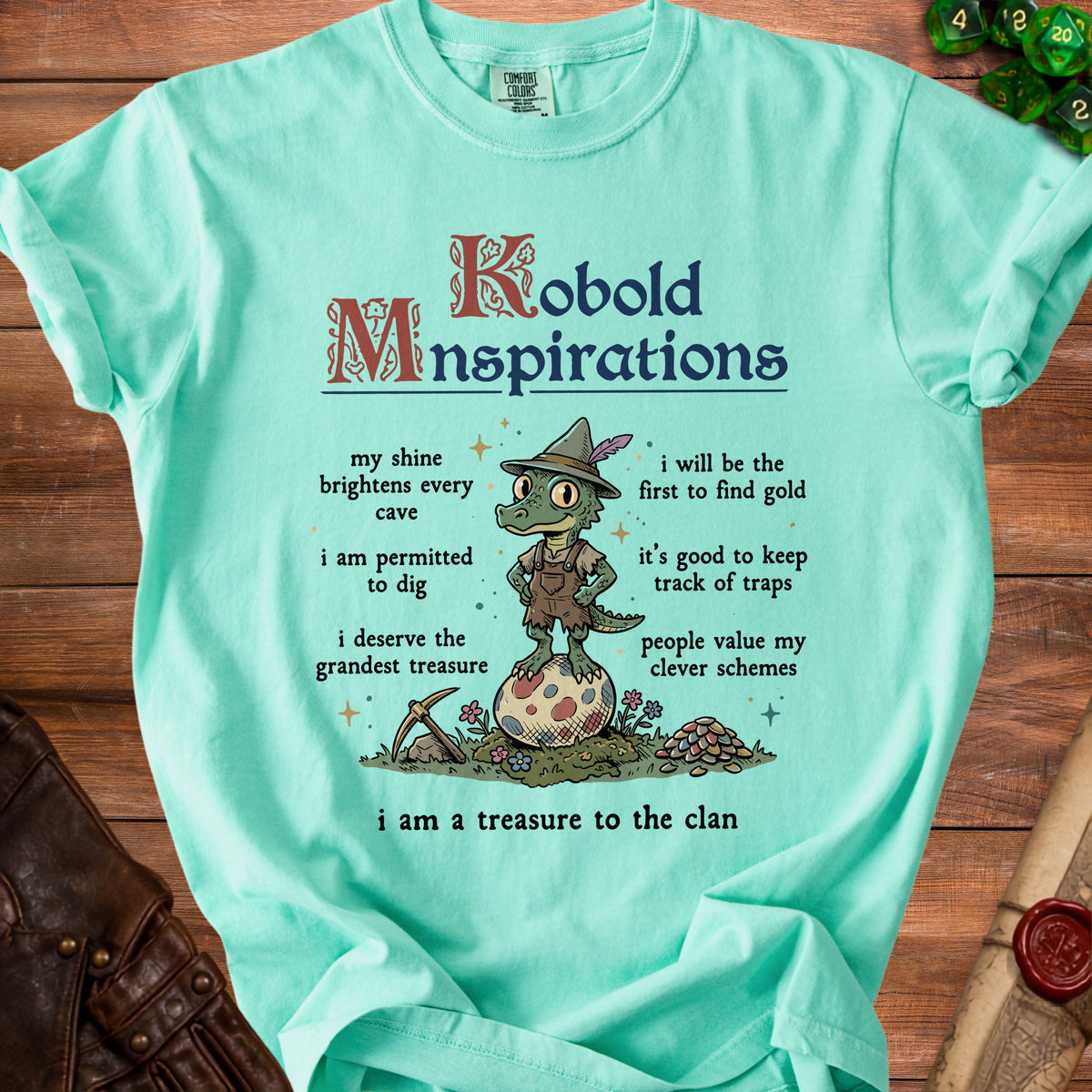 Mint green t-shirt with "Kobold Minspirations" and a cartoon kobold with mining tools.