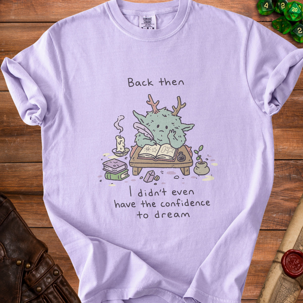 T-shirt with cartoon monster writing and text "Back then I didn't even have the confidence to dream."