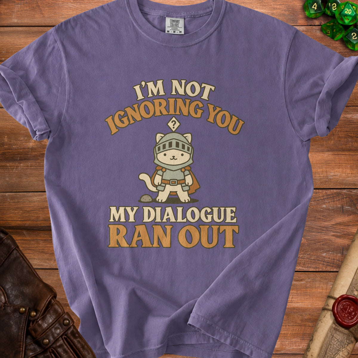 Purple t-shirt with a knight cat and text "I'M NOT IGNORING YOU MY DIALOGUE RAN OUT".