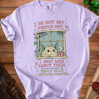 Lavender t-shirt with text "I DO NOT CUT PEOPLE OFF. I JUST CARE ABOUT THEM FROM A GREAT DISTANCE FOREVER." and a cat looking out a rainy window.