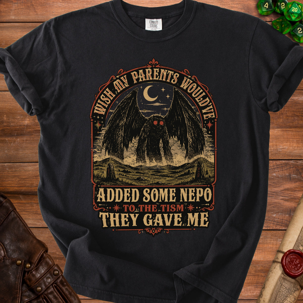 Black t-shirt with Mothman graphic and text "Wish my parents would've added some nepo to the tism they gave me."