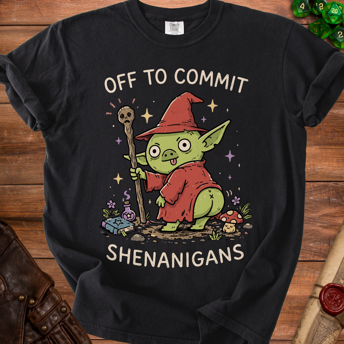 Black t-shirt with a green goblin character wearing a wizard hat and holding a staff.