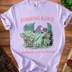 Light purple t-shirt with "DUNGEONS & CATS" and three cats as barbarian, wizard, and rogue.