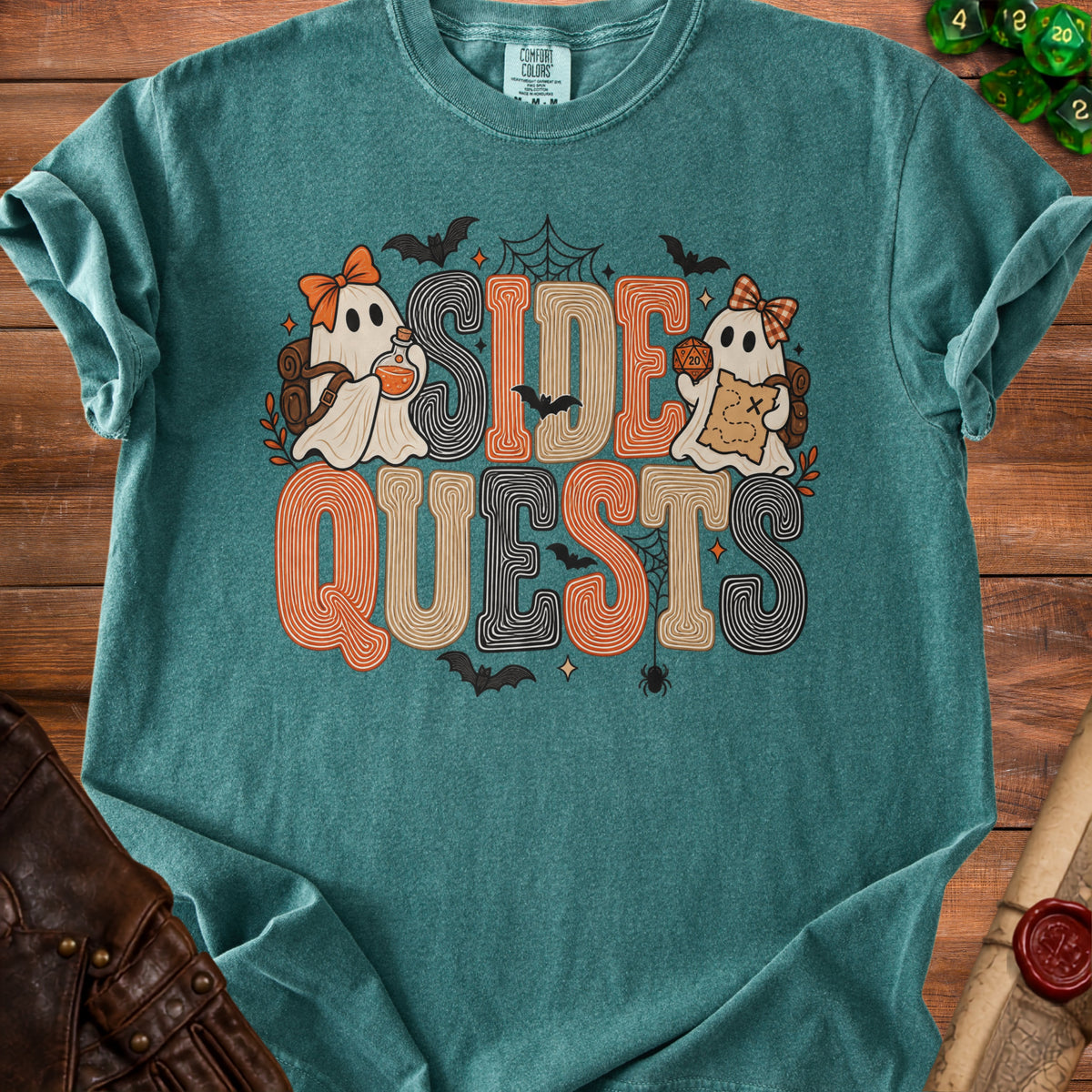 Teal t-shirt with "SIDE QUESTS" text and ghosts holding potion and map.