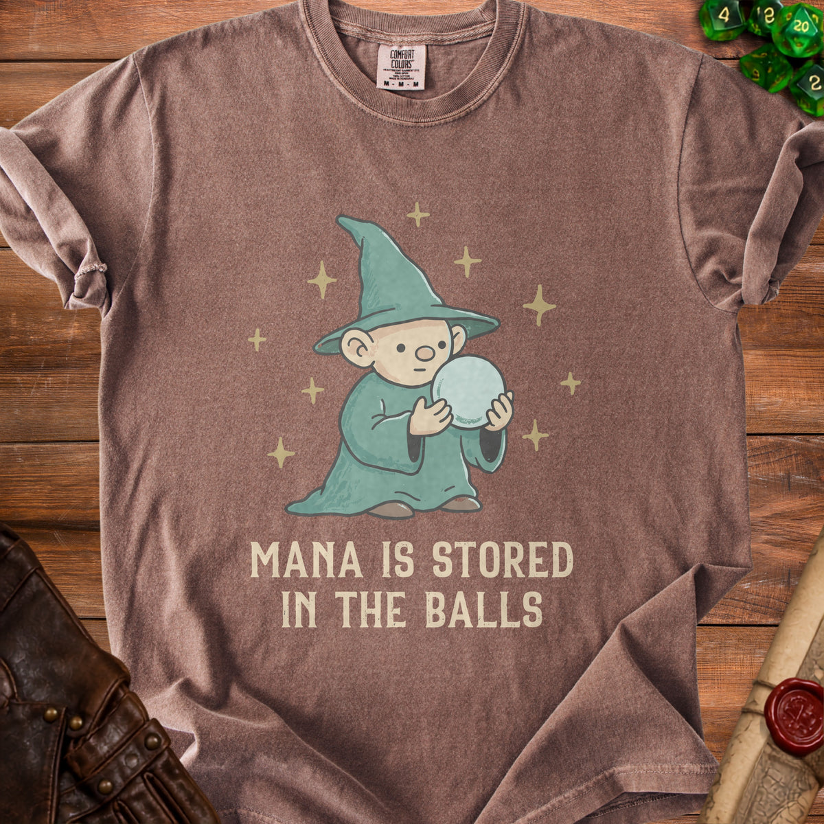 Brown t-shirt with cartoon wizard holding a orb, text reads "MANA IS STORED IN THE BALLS".