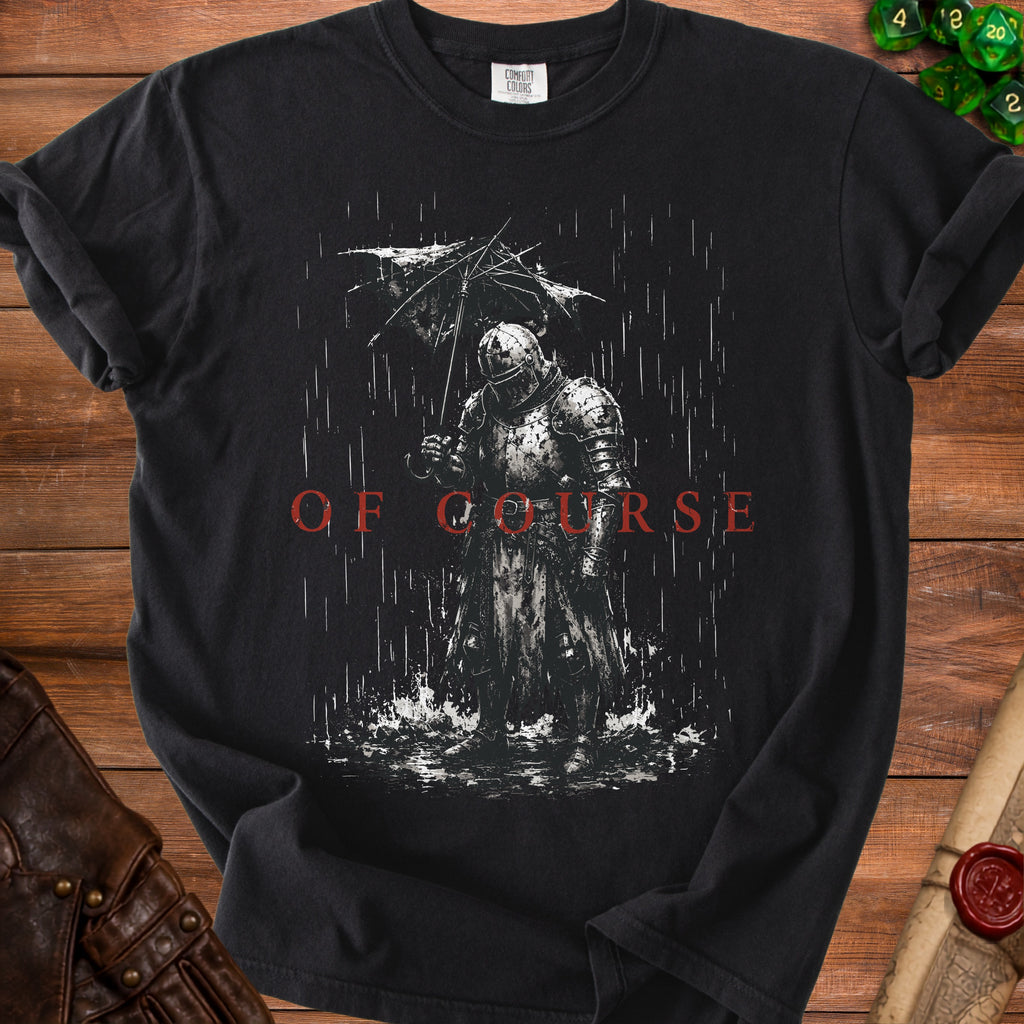 Black t-shirt graphic of armored knight holding umbrella in rain, with text "OF COURSE."