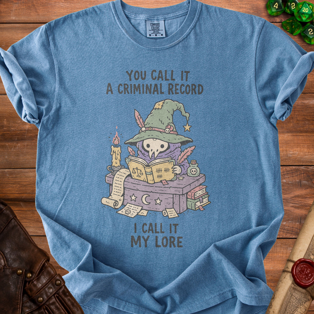 Blue t-shirt with cartoon plague doctor wizard, text "You call it a criminal record, I call it my lore".
