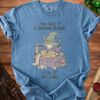 Blue t-shirt with cartoon plague doctor wizard, text "You call it a criminal record, I call it my lore".
