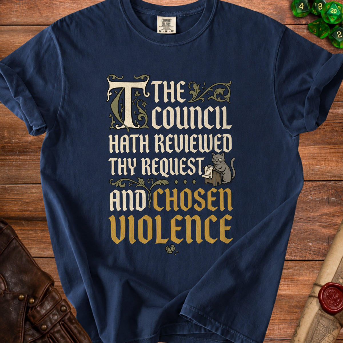 Dark blue t-shirt with medieval text and a cat holding a scroll.