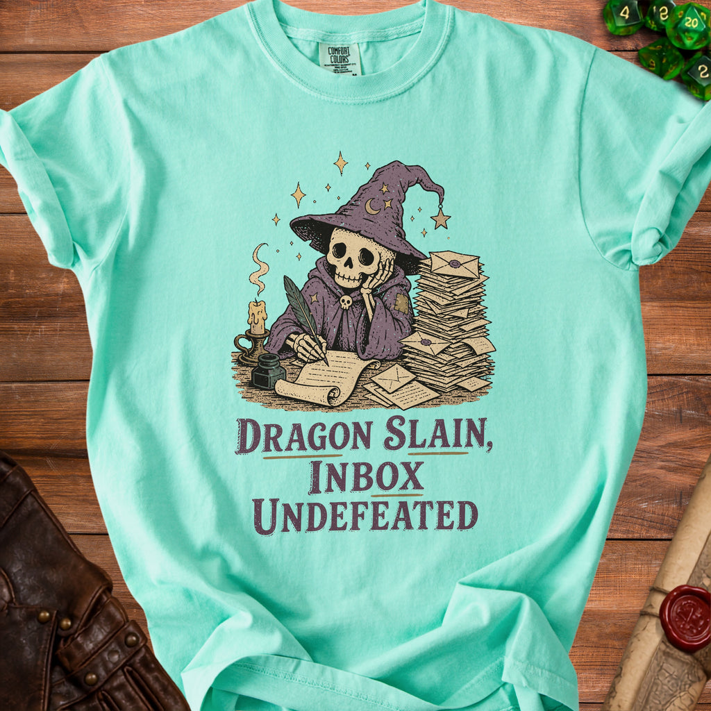 Mint green t-shirt with skeleton wizard graphic and text "Dragon Slain, Inbox Undefeated".