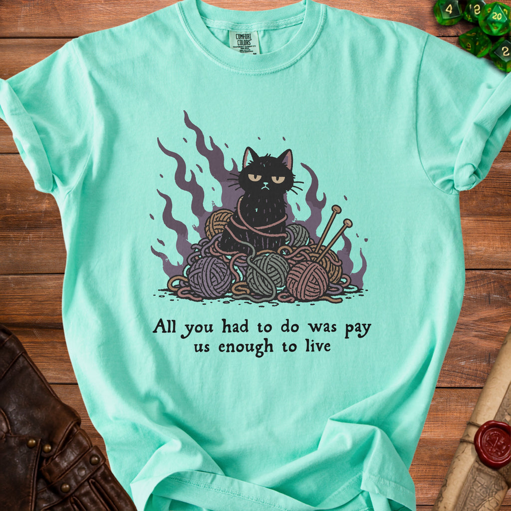 Mint green t-shirt with grumpy cat tangled in yarn and knitting needles.