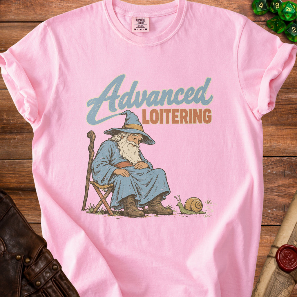 Pink t-shirt with a wizard sleeping next to a snail, text reads "Advanced LOITERING".