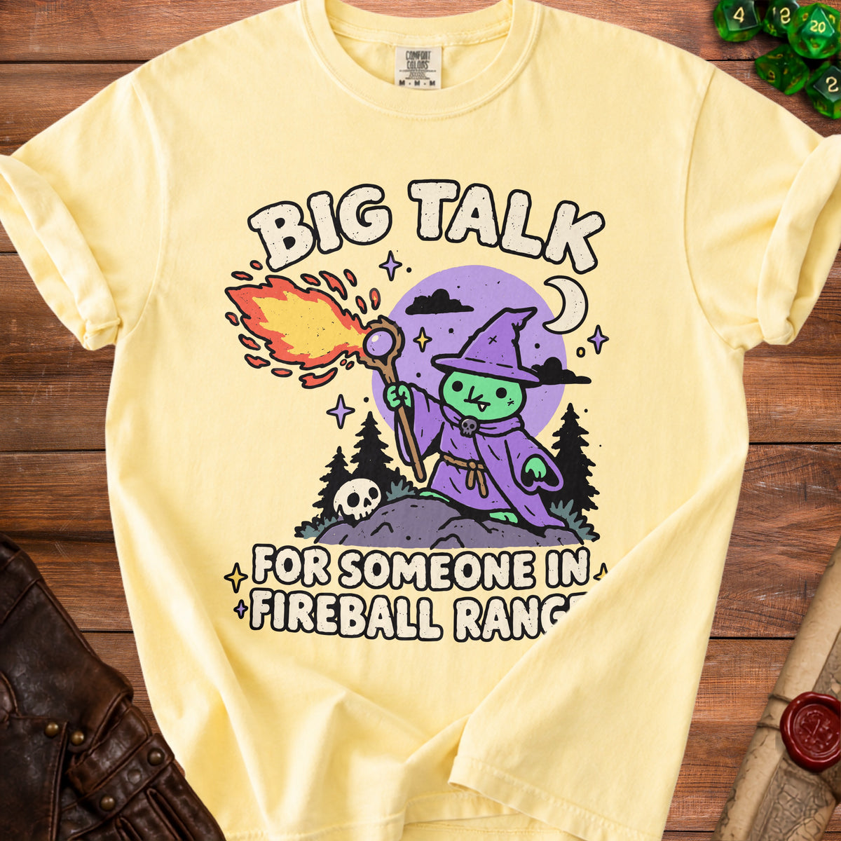 Yellow t-shirt with cartoon wizard casting fireball, saying "BIG TALK FOR SOMEONE IN FIREBALL RANGE."
