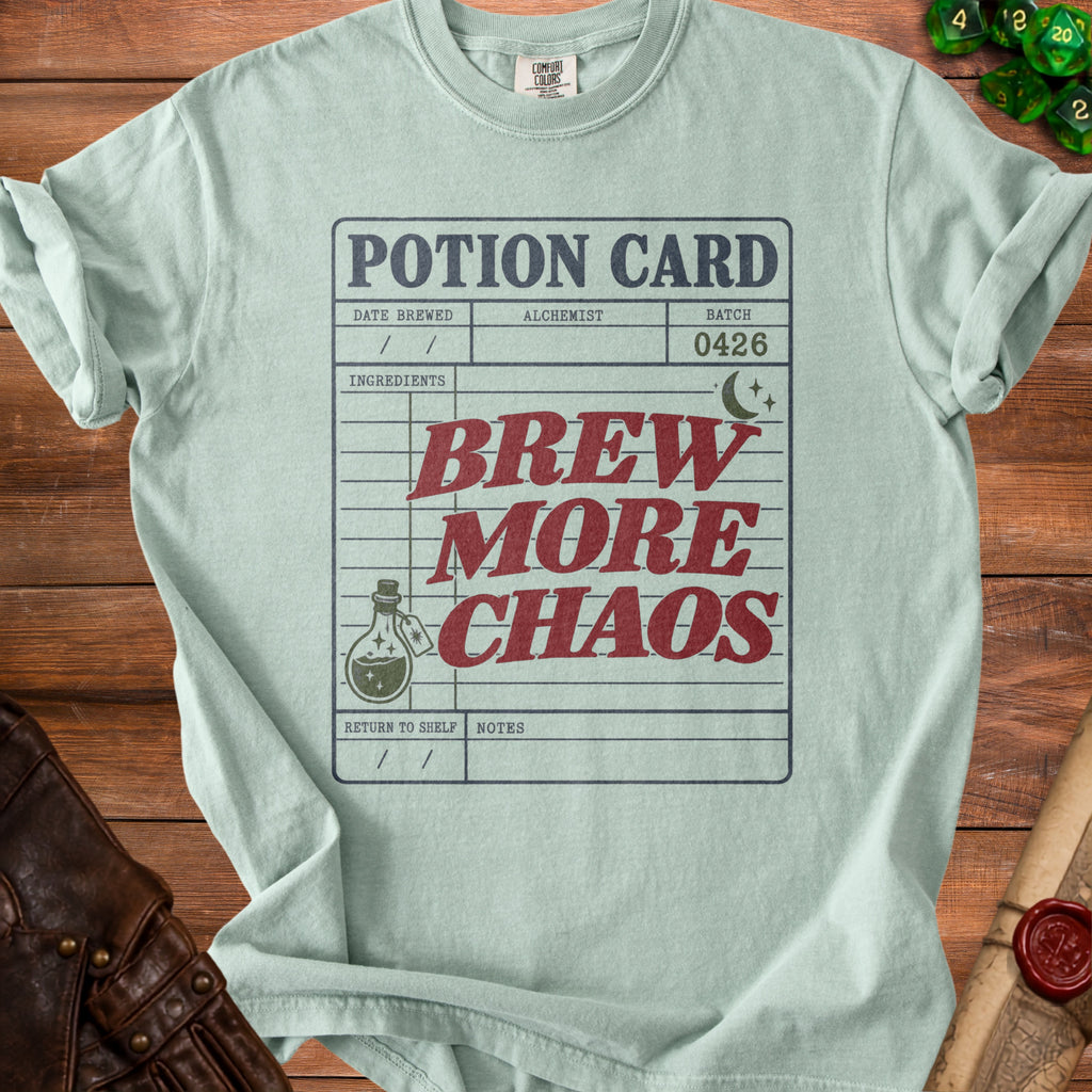 Mint green t-shirt with "POTION CARD BREW MORE CHAOS" text and potion bottle graphic.