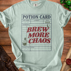 Mint green t-shirt with "POTION CARD BREW MORE CHAOS" text and potion bottle graphic.