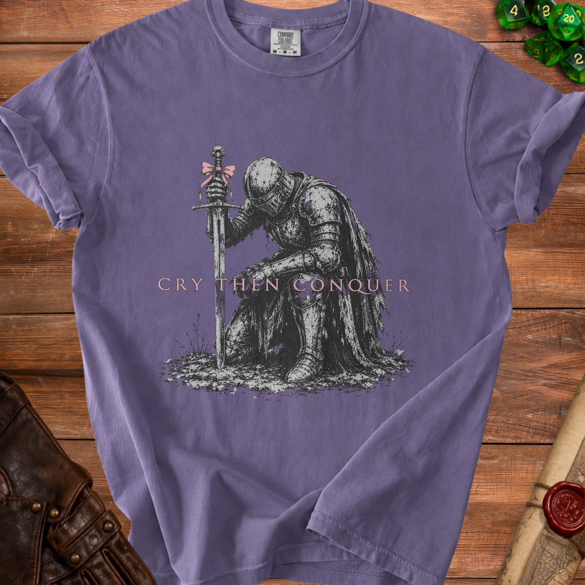 T-shirt with knight kneeling by sword with pink bow, text reads "CRY THEN CONQUER".