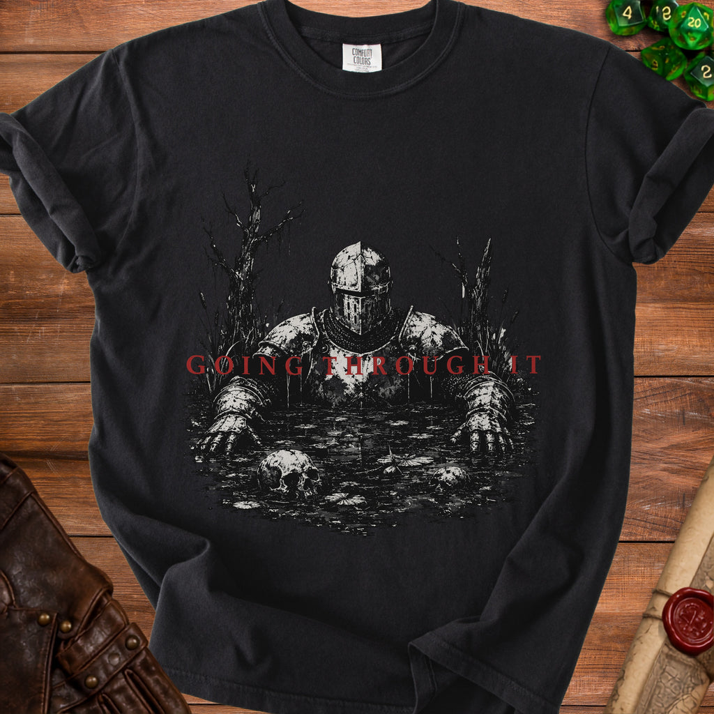Black t-shirt with knight in swamp and text "GOING THROUGH IT".