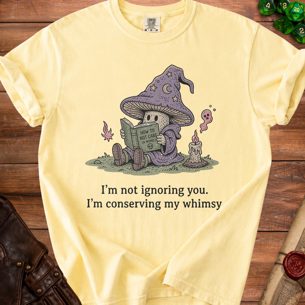 Yellow t-shirt with wizard mushroom reading "How to Not Care".