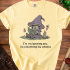 Yellow t-shirt with wizard mushroom reading "How to Not Care".