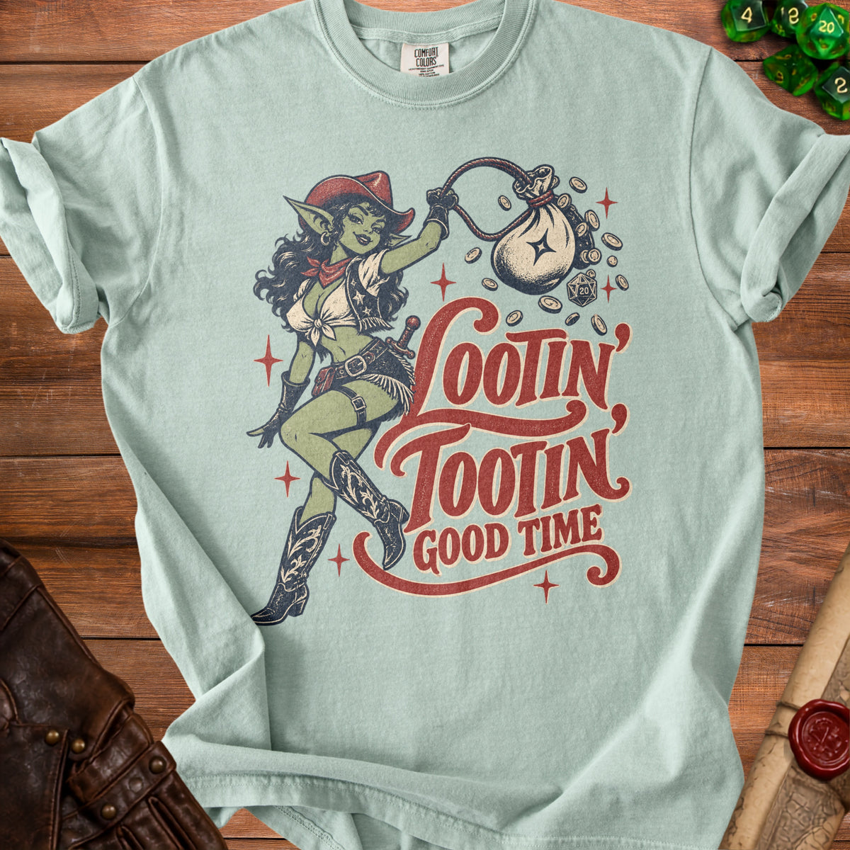 Light blue t-shirt with goblin holding a money bag, text "Lootin' Tootin' Good Time."