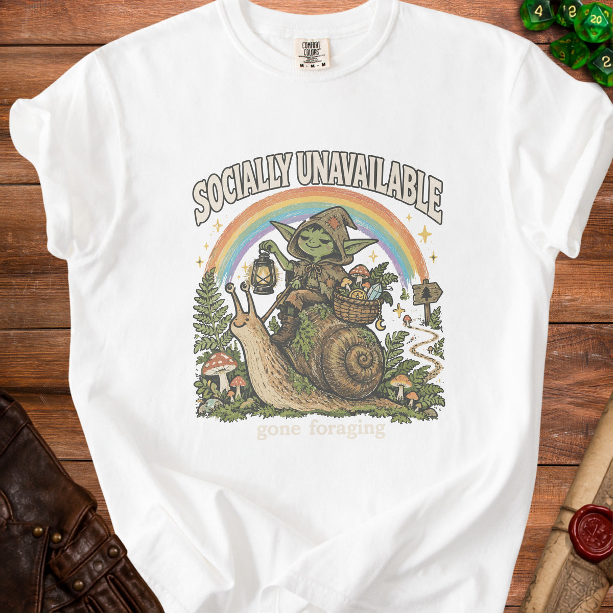 White t-shirt with "Socially Unavailable" text and goblin riding snail design.