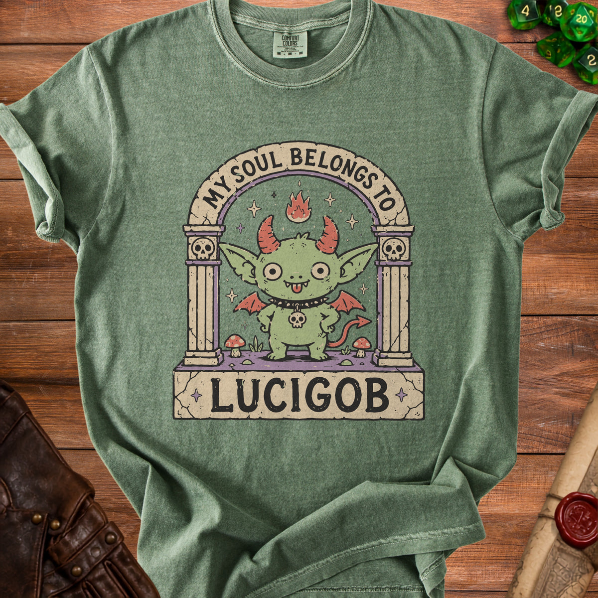 Green t-shirt with a cartoon devil illustration and text "MY SOUL BELONGS TO LUCIGOB".