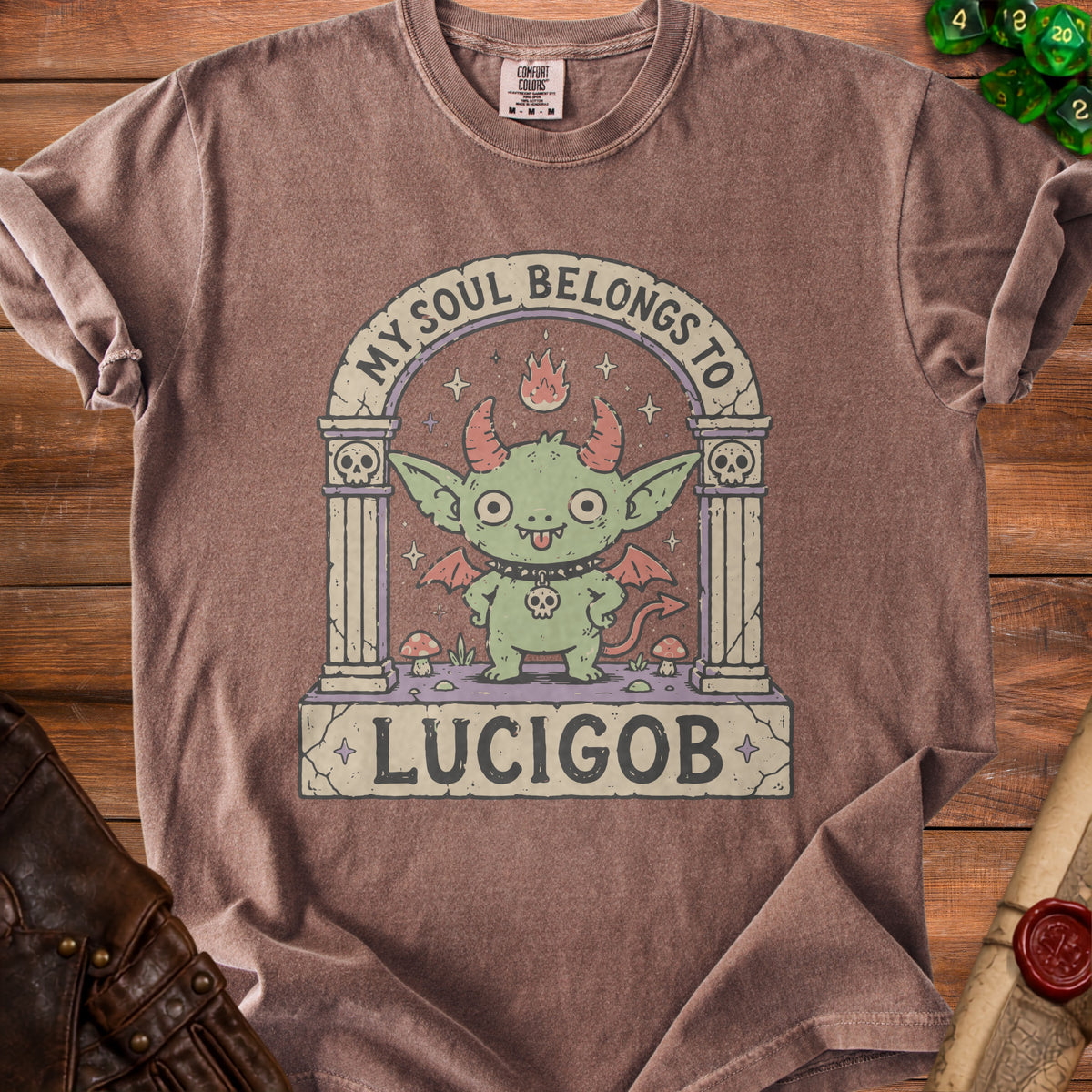 Brown t-shirt with a graphic of a green devil character and text "MY SOUL BELONGS TO LUCIGOB".