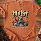 Orange t-shirt with "moist" text above a cartoon knight in swampy water.