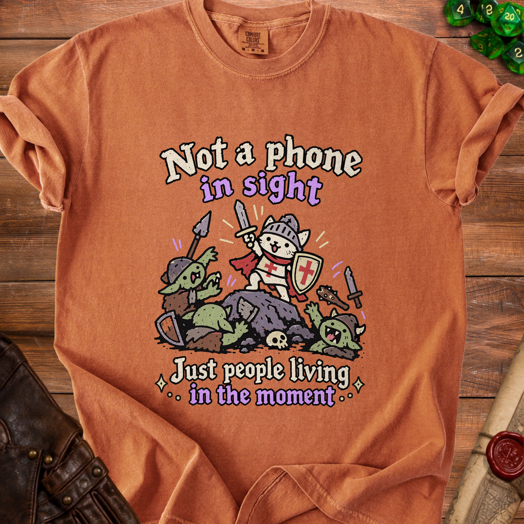 Orange t-shirt with knight cat battling goblins, text "Not a phone in sight."