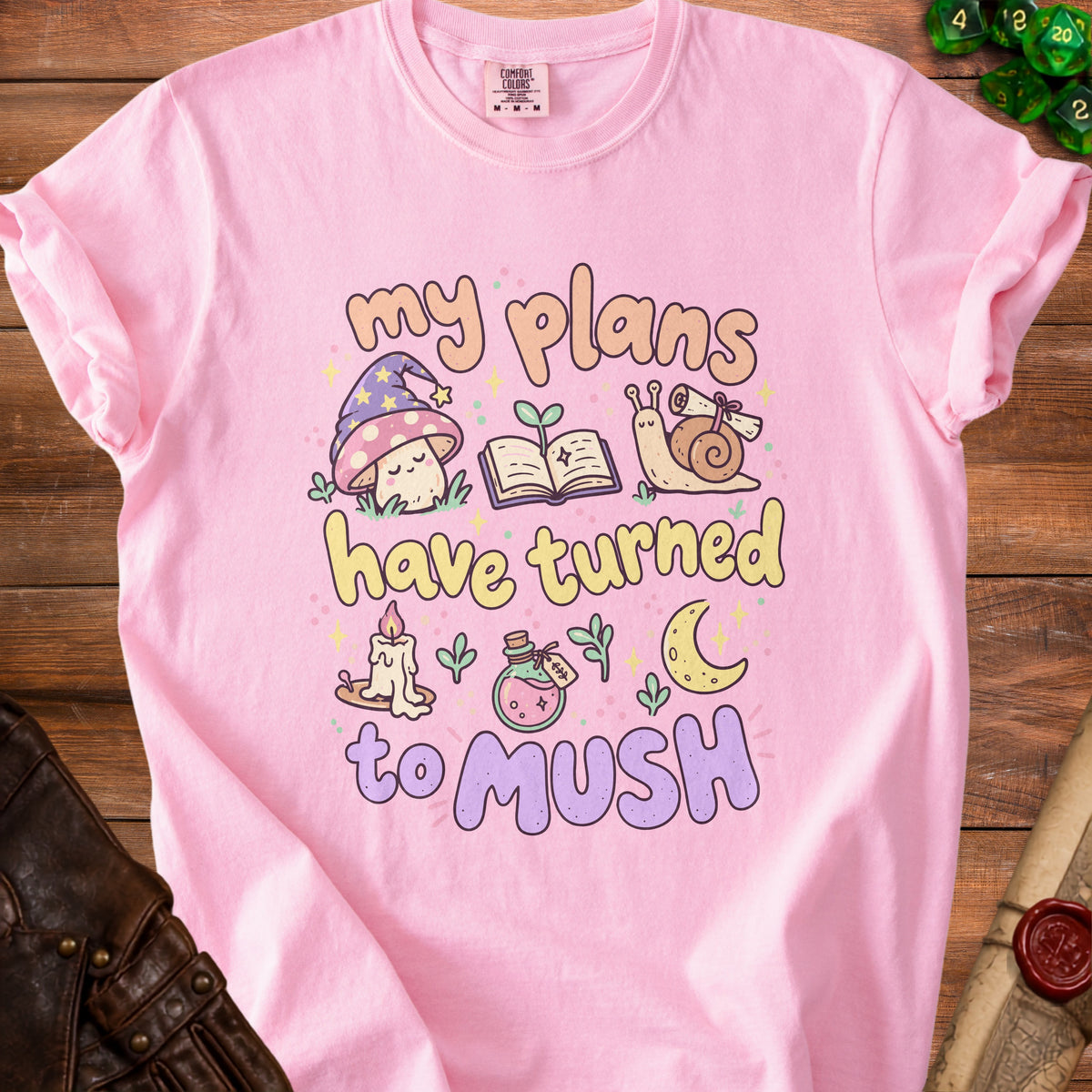 Pink t-shirt with "my plans have turned to mush" and cute mushroom, snail, and book graphics.