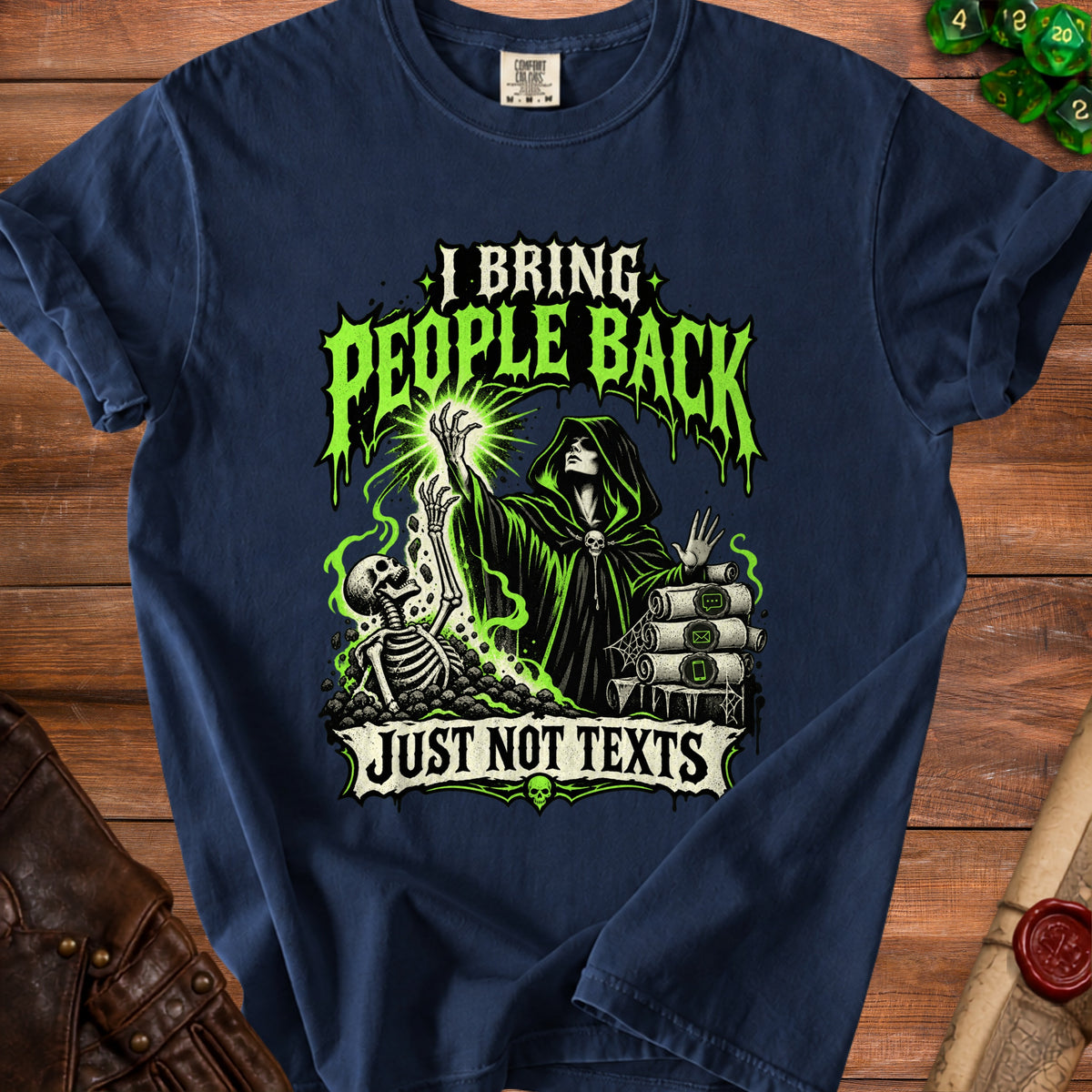 Navy blue t-shirt featuring a hooded necromancer, a rising skeleton, and text that reads I BRING PEOPLE BACK JUST NOT TEXTS.